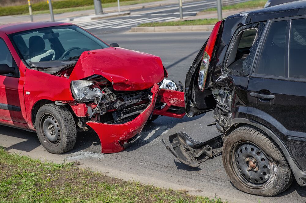 Car crash accident on street, damaged automobiles after collision in city