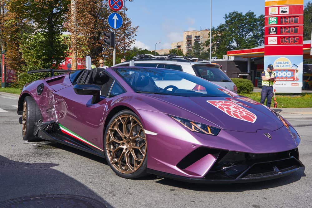 luxury sports car after collision with a crossover,