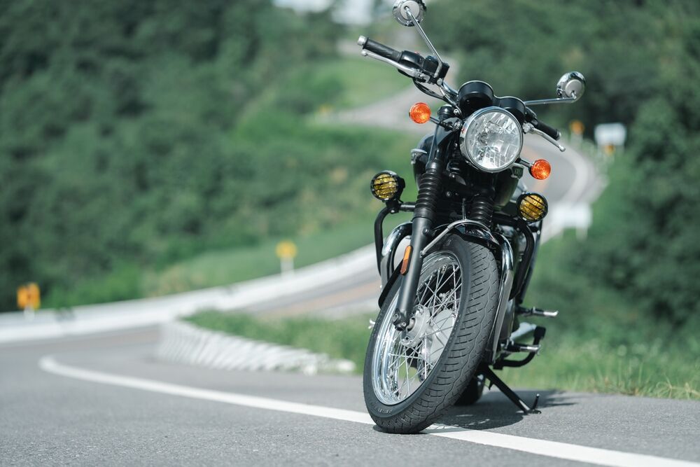 Motorcycle in a sunny motorbike on the road riding.with sunset light. copyspace for your individual text. classic motorcycle.